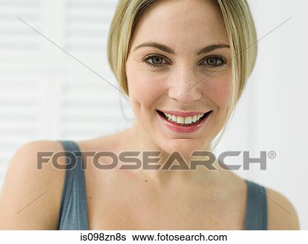 Stock Photograph - Portrait of young woman in bathroom. Fotosearch