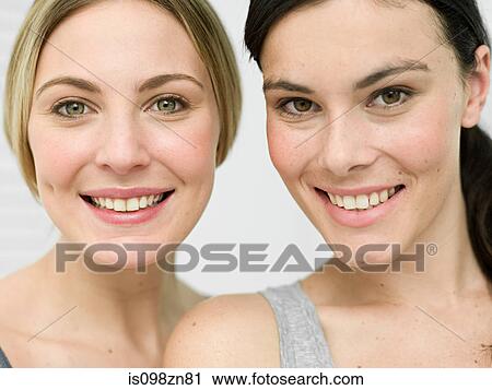 Stock Image - Portrait of young women in bathroom. Fotosearch