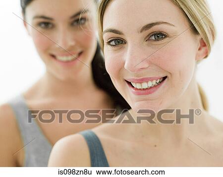 Stock Photograph - Portrait of young women in bathroom. Fotosearch