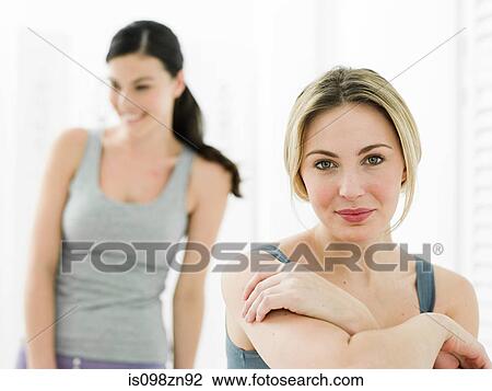 Stock Image - Young women in bathroom. Fotosearch