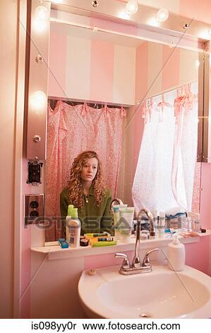 Sad teenage girl reflected in bathroom mirror View Large Photo Image Stock Photography - Sad teenage girl reflected in bathroom mirror. Fotosearch