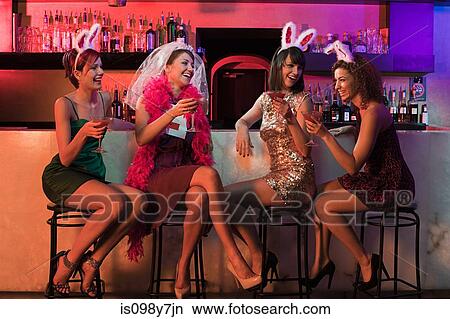 Picture - Four young women on hen night. Fotosearch