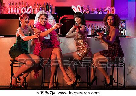 Four young women on hen night View Large Photo Image Stock Photo - Four young women on hen night. Fotosearch