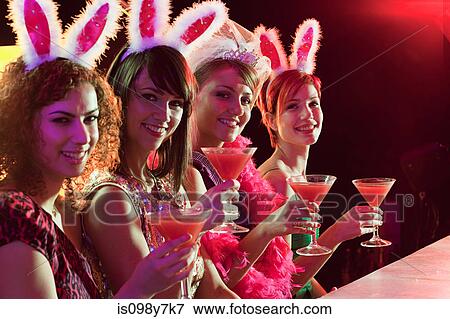 Four young women on hen night View Large Photo Image Stock Photo - Four young women on hen night. Fotosearch