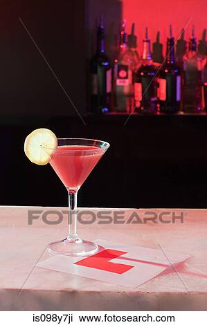 Pink cocktail and L plate on bar View Large Photo Image Stock Image - Pink cocktail and L plate on bar. Fotosearch