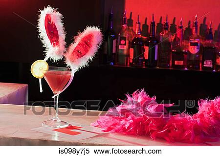 Pink cocktail, bunny ears and L plate on bar View Large Photo Image Stock Photography - Pink cocktail, bunny ears and L plate on bar. Fotosearch