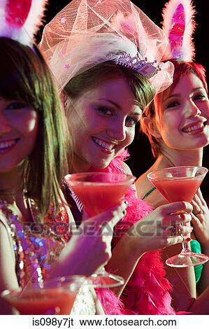 Stock Photograph - Young women on hen night. Fotosearch