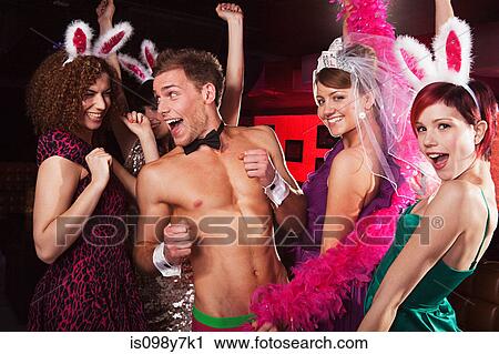 Young women on hen night with male stripper View Large Photo Image Stock Image - Young women on hen night with male stripper. Fotosearch