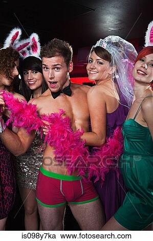 Young women on hen night with male stripper View Large Photo Image Stock Image - Young women on hen night with male stripper. Fotosearch