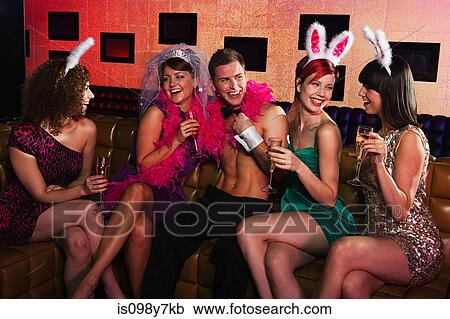 Young women on hen night with male stripper View Large Photo Image Stock Image - Young women on hen night with male stripper. Fotosearch