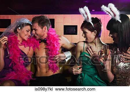 Young women on hen night with male stripper View Large Photo Image Stock Image - Young women on hen night with male stripper. Fotosearch