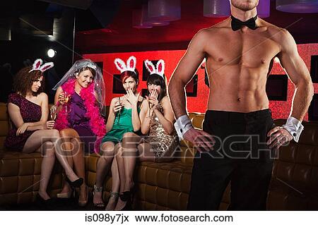 Young women on hen night with male stripper View Large Photo Image Stock Photo - Young women on hen night with male stripper. Fotosearch