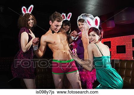 Stock Photograph - Young women on hen night with male stripper. Fotosearch
