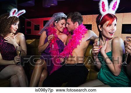 Stock Photography - Young women on hen night with male stripper. Fotosearch