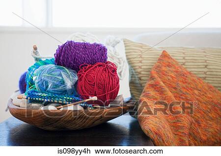 Stock Image - Balls of wool and knitting needles. Fotosearch