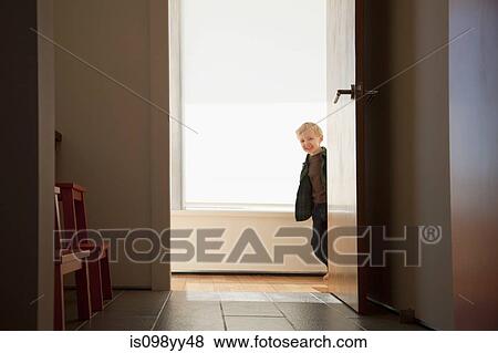 Boy peeking round doorway View Large Photo Image Stock Photo - Boy peeking round doorway. Fotosearch