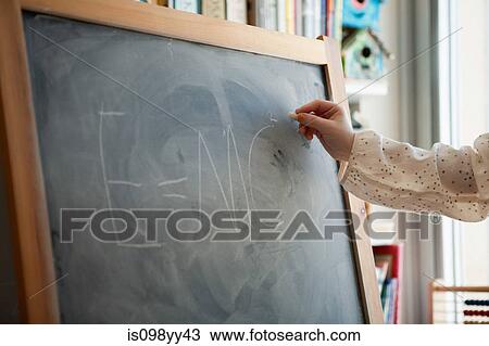 Girl writing E=MC2 on blackboard View Large Photo Image Stock Image - Girl writing E=MC2 on blackboard. Fotosearch
