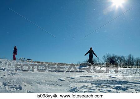 Mother and daughter with toboggan View Large Photo Image Stock Image - Mother and daughter with toboggan. Fotosearch
