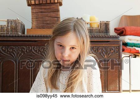 Stock Photography - Serious young girl, portrait. Fotosearch