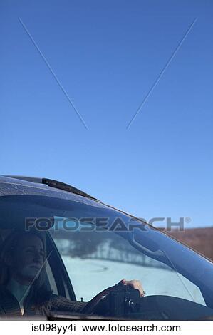 Woman driving car View Large Photo Image Stock Image - Woman driving car. Fotosearch