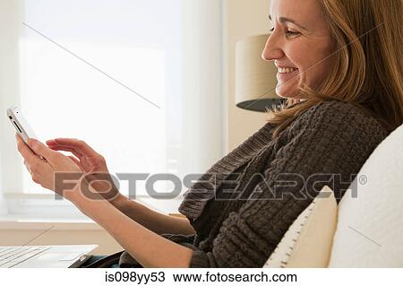 Stock Image - Woman using smartphone. Fotosearch