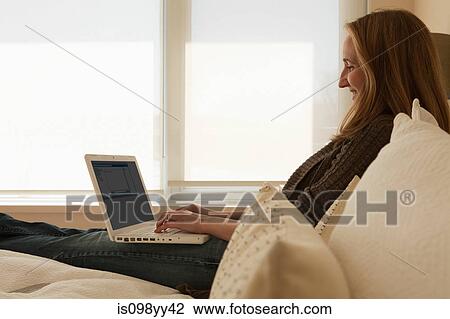 Woman working from home using laptop View Large Photo Image Stock Image - Woman working from home using laptop. Fotosearch