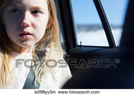 Young girl wearing car seatbelt View Large Photo Image Picture - Young girl wearing car seatbelt. Fotosearch