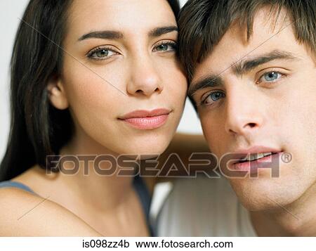 Stock Image - Young couple embracing close-up, portrait. Fotosearch
