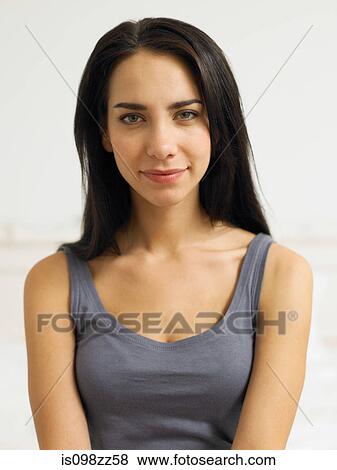 Young woman wearing grey vest, portrait View Large Photo Image Stock Photo - Young woman wearing grey vest, portrait. Fotosearch