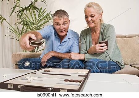 Couple playing backgammon View Large Photo Image Stock Image - Couple playing backgammon. Fotosearch