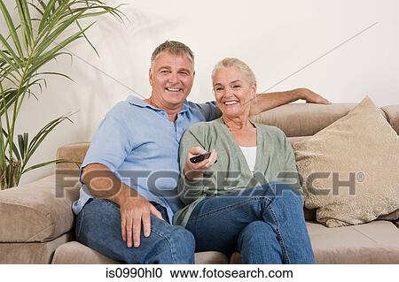 Couple watching television View Large Photo Image Stock Image - Couple watching television. Fotosearch
