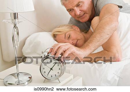 Man reaching to turn off alarm View Large Photo Image Stock Image - Man reaching to turn off alarm. Fotosearch