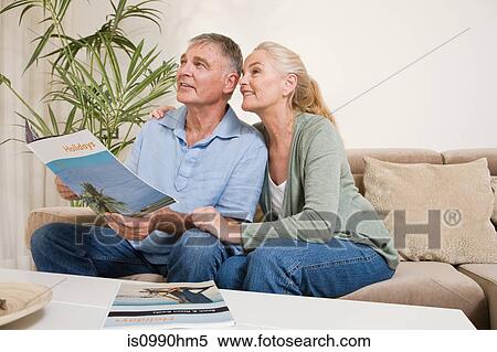 Mature couple planning a holiday View Large Photo Image Stock Photography - Mature couple planning a holiday. Fotosearch