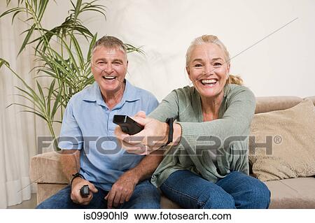 Mature couple playing video game View Large Photo Image Stock Photo - Mature couple playing video game. Fotosearch