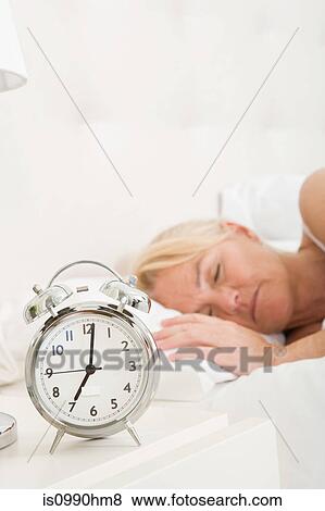 Mature woman asleep in bed View Large Photo Image Stock Photo - Mature woman asleep in bed. Fotosearch