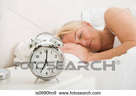 Mature woman asleep in bed View Large Photo Image Stock Photo - Mature woman asleep in bed. Fotosearch