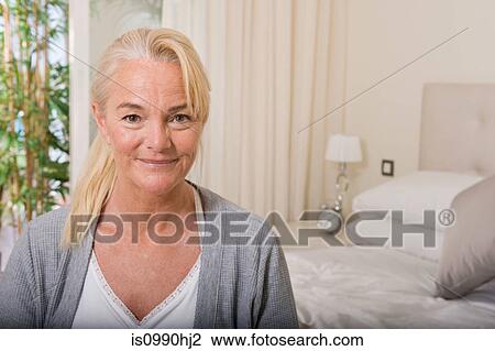 Mature woman in bedroom View Large Photo Image Stock Image - Mature woman in bedroom. Fotosearch