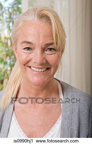 Portrait of a mature woman View Large Photo Image Stock Image - Portrait of a mature woman. Fotosearch