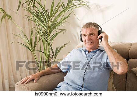 Senior man listening to music View Large Photo Image Stock Image - Senior man listening to music. Fotosearch