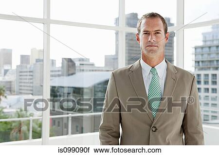 Businessman in office, portrait View Large Photo Image Stock Image - Businessman in office, portrait. Fotosearch