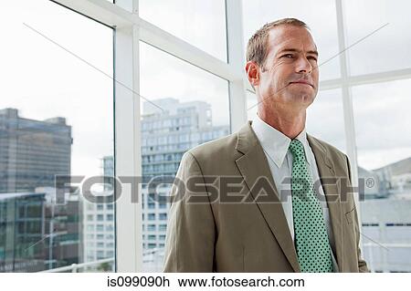 Stock Image - Businessman in office, portrait. Fotosearch