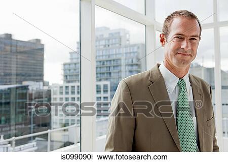 Businessman in office, portrait View Large Photo Image Stock Image - Businessman in office, portrait. Fotosearch