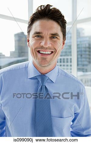 Businessman in office, portrait View Large Photo Image Stock Image - Businessman in office, portrait. Fotosearch