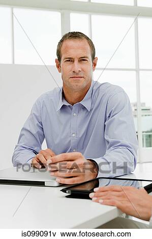 Stock Photo - Businessman in office. Fotosearch