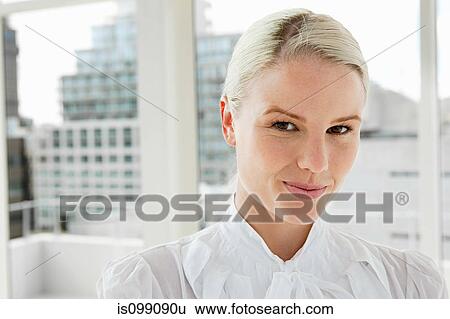 Businesswoman wearing white blouse, portrait View Large Photo Image Stock Photograph - Businesswoman wearing white blouse, portrait. Fotosearch