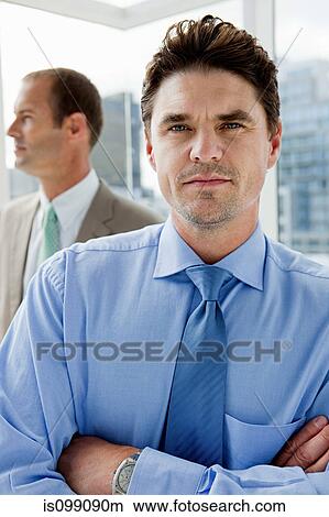 Picture - Two businessmen in office, portrait. Fotosearch