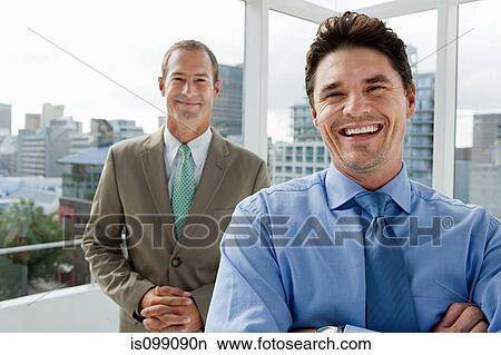 Two businessmen in office, portrait View Large Photo Image Picture - Two businessmen in office, portrait. Fotosearch