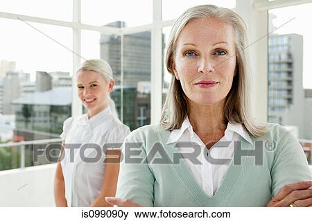 Two businesswomen in office, portrait View Large Photo Image Stock Photo - Two businesswomen in office, portrait. Fotosearch