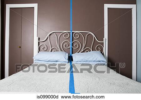 Double bed separated by blue line View Large Photo Image Stock Image - Double bed separated by blue line. Fotosearch