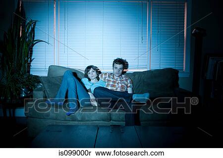 Young couple watching tv, bored View Large Photo Image Stock Photography - Young couple watching tv, bored. Fotosearch